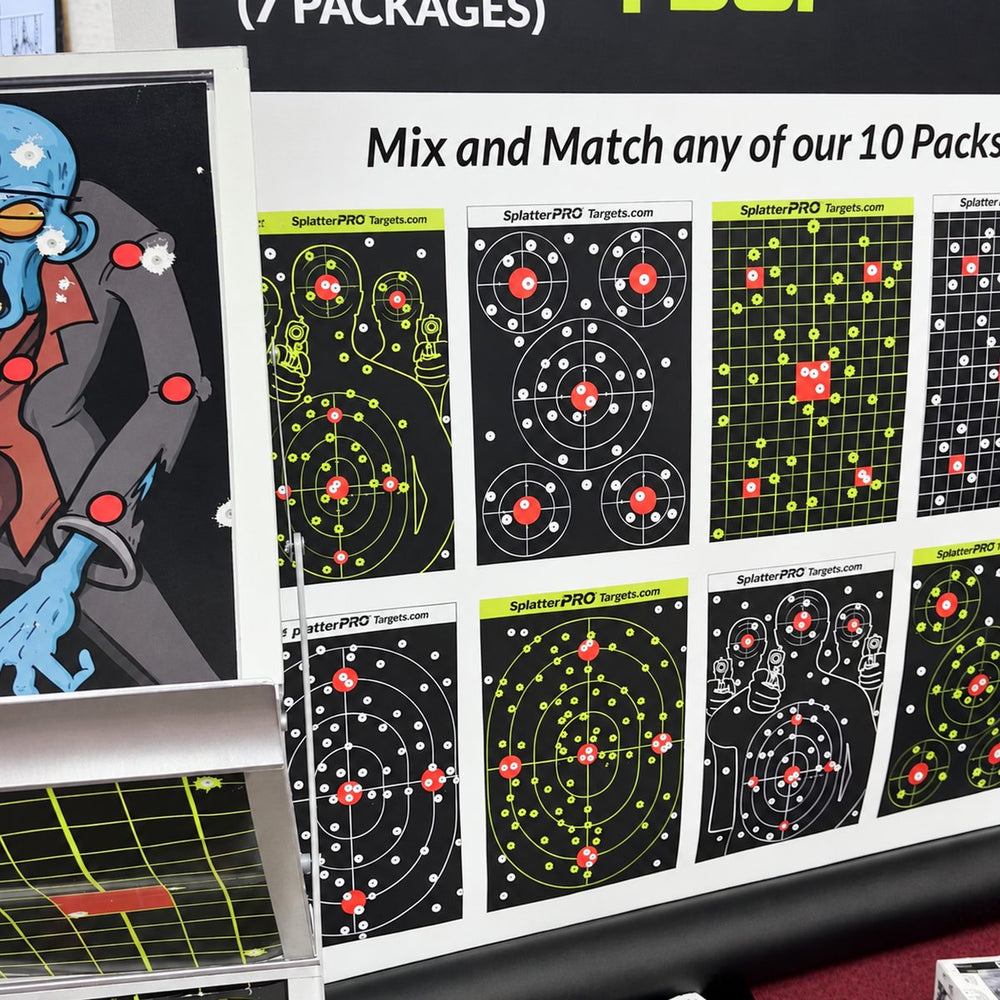 A wall of 12x18 splatter target designs with a zombie target on the display rack
