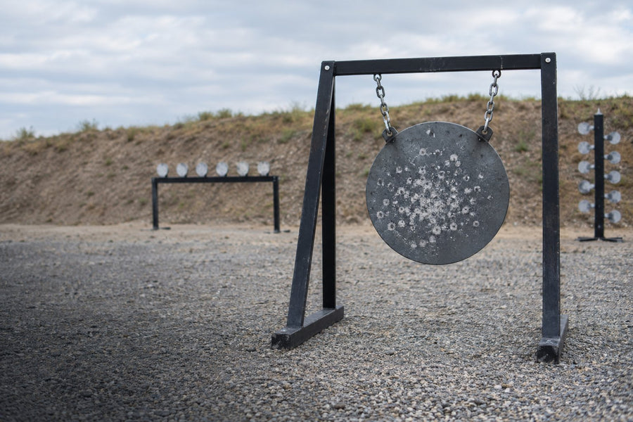 AR500 steel gong on a stand at an outdoor range