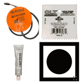 Steel target heater kit contents: orange heater pad with lead, notched spreader, sealant tube and black dot card