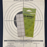 IR Tools 25M pasters in green packs laid on a Universal MOA 25M zeroing target