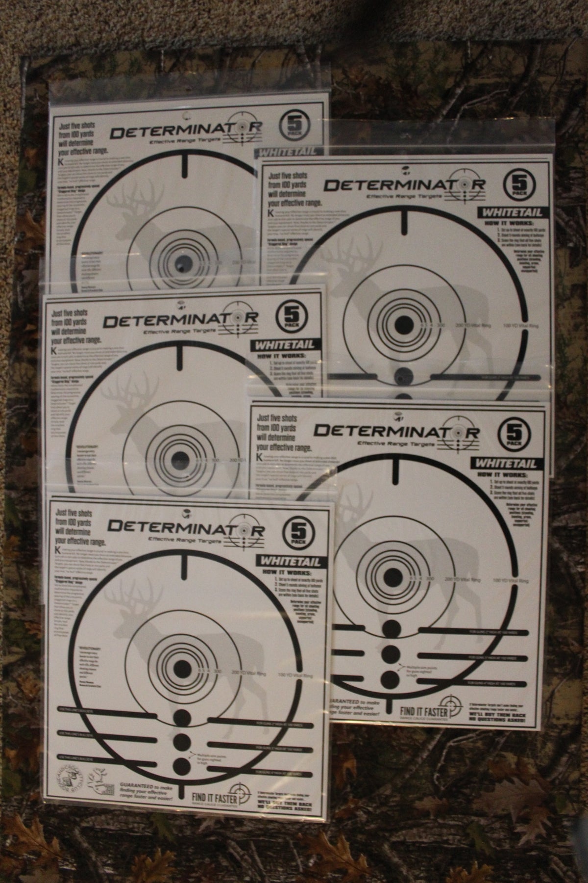 Determinator Whitetail Deer Obsession: five target packs fanned out on a wooden table