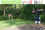 Traditional straw target in use: an archer shooting at it in a park, with a no broadheads note — image 4