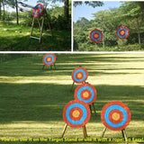 Traditional straw targets set up on stands and hung by rope around a park lawn — image 7